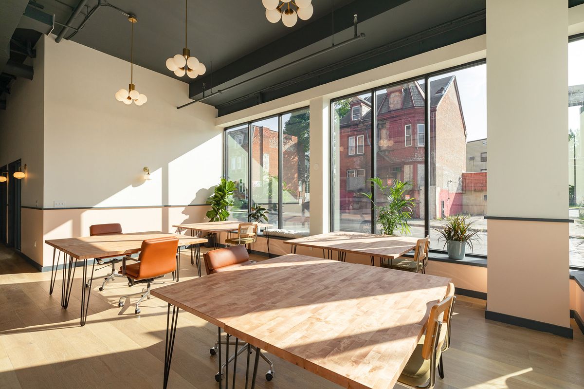 Private offices and dedicated desks in a light-filled workspace